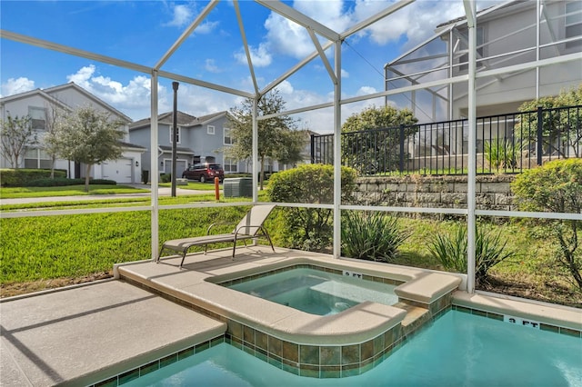 view of pool featuring glass enclosure and an in ground hot tub