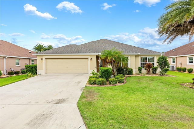 single story home featuring a garage and a front lawn