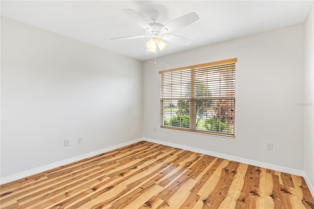 unfurnished room with ceiling fan and hardwood / wood-style floors