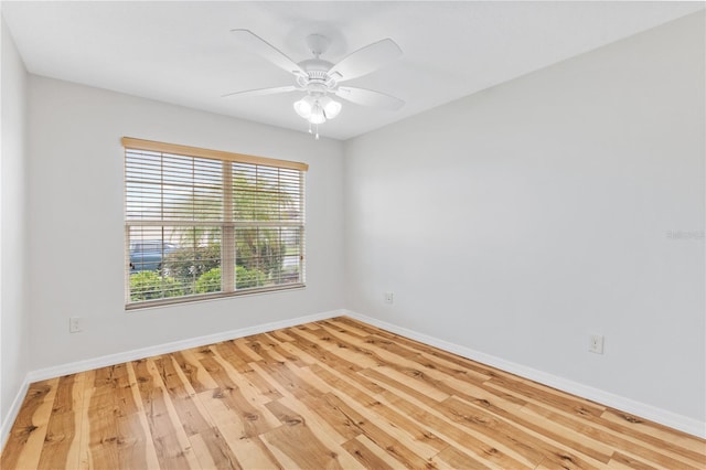 empty room featuring light hardwood / wood-style flooring and ceiling fan