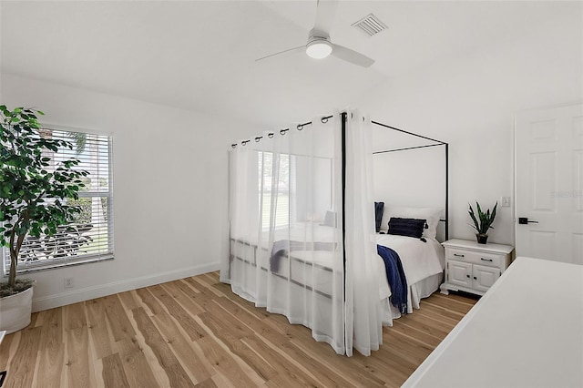 bedroom featuring light wood-type flooring and ceiling fan