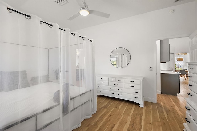 bedroom featuring light wood-type flooring and ceiling fan