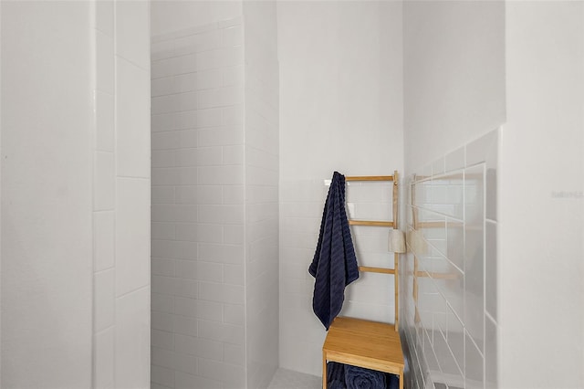 bathroom with tiled shower