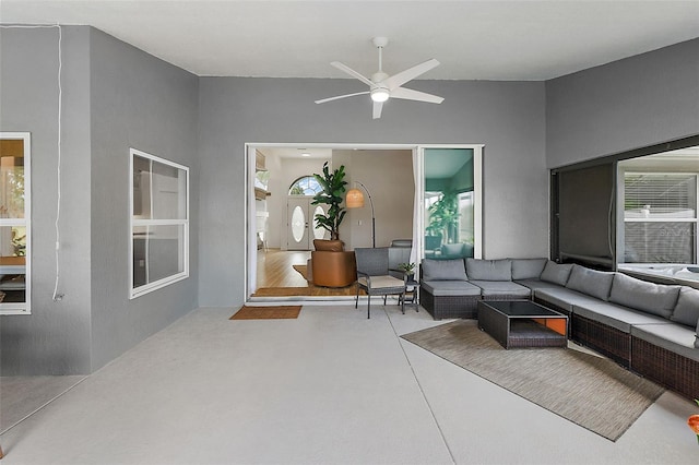 living room featuring ceiling fan