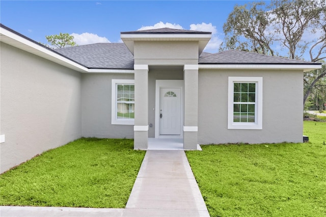 view of front of property with a front lawn