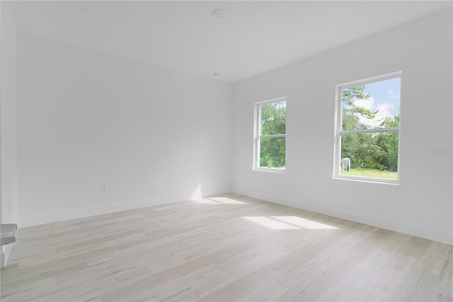 unfurnished room with light hardwood / wood-style flooring