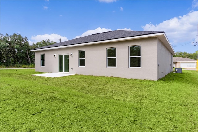 back of house with a yard, central AC unit, and a patio