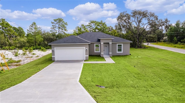 view of front of property with a garage and a front yard