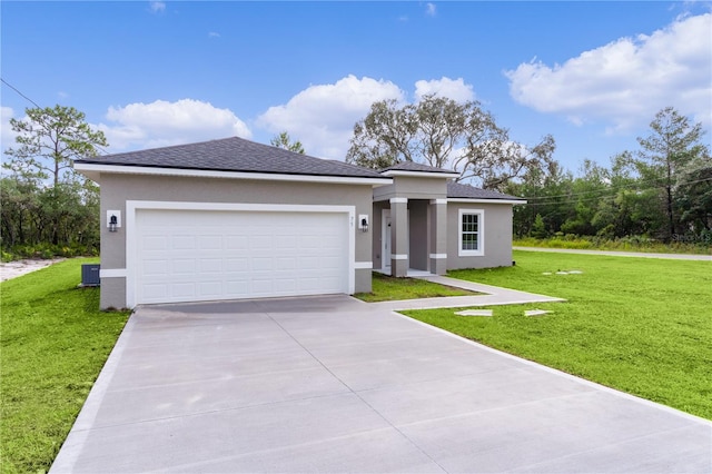 view of front facade featuring a front lawn and a garage