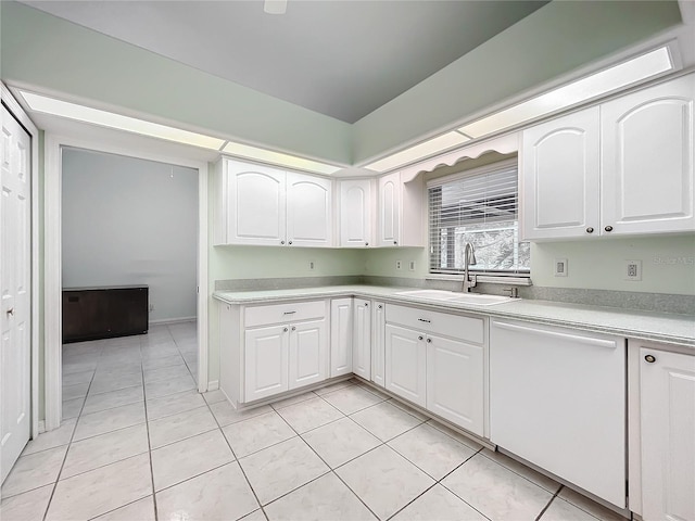 kitchen with sink, white dishwasher, and white cabinets