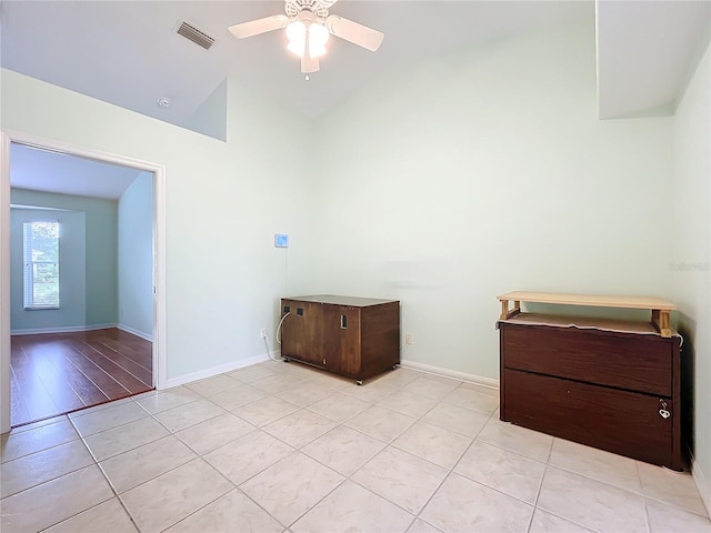 unfurnished bedroom featuring vaulted ceiling, light wood-type flooring, and ceiling fan