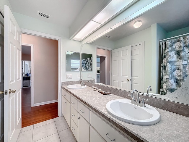 bathroom featuring vanity and hardwood / wood-style floors