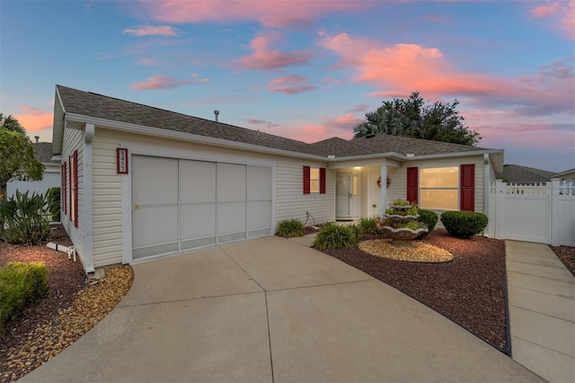 ranch-style home featuring a garage