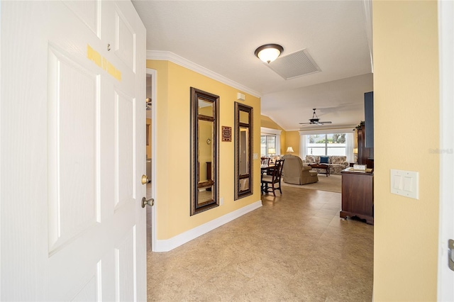 hall with light carpet, crown molding, and vaulted ceiling