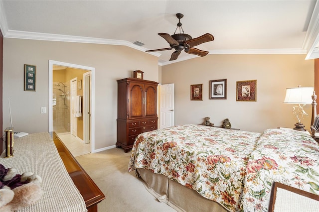 carpeted bedroom featuring ceiling fan, ornamental molding, lofted ceiling, and ensuite bathroom