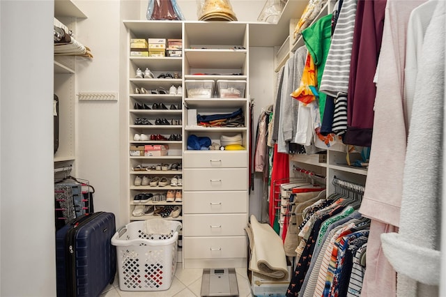 spacious closet featuring light tile patterned floors