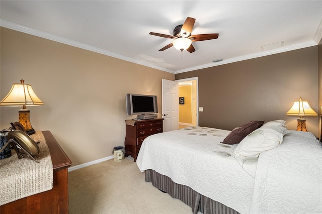 bedroom featuring carpet floors, ornamental molding, and ceiling fan