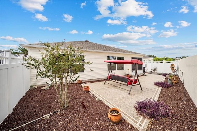 rear view of house with a patio