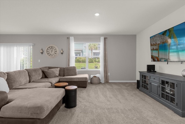 carpeted living room with a healthy amount of sunlight