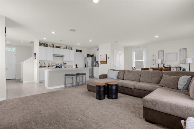 living room featuring light carpet