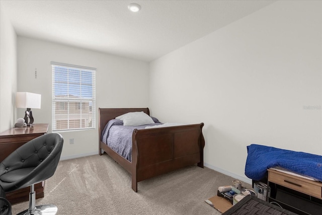 bedroom with light colored carpet