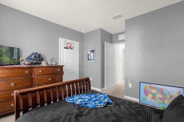 bedroom featuring light colored carpet