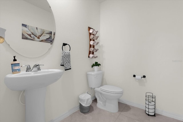 bathroom featuring tile patterned flooring and toilet