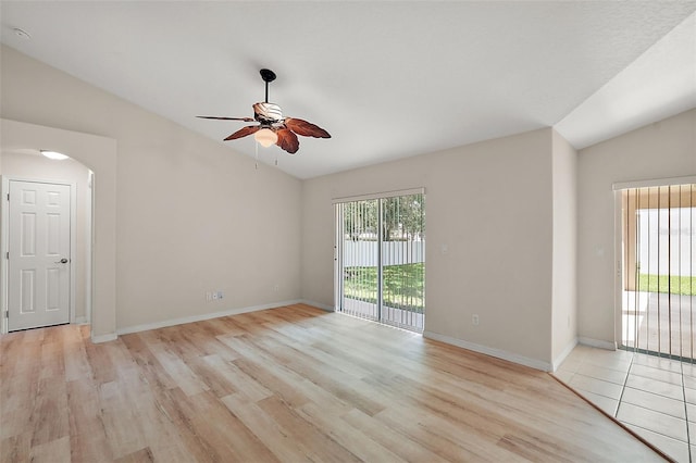 spare room featuring lofted ceiling, ceiling fan, and light hardwood / wood-style floors