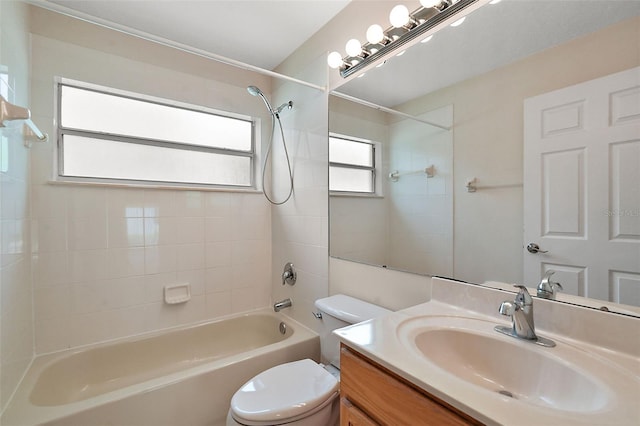 full bathroom featuring vanity, toilet, and tiled shower / bath