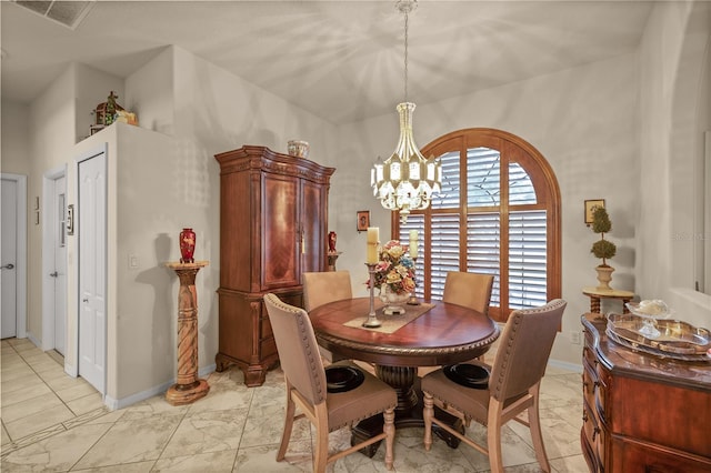 dining area with a chandelier