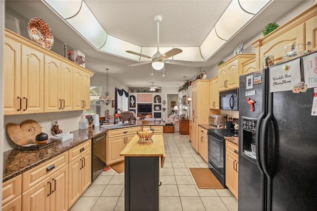 kitchen with sink, black appliances, kitchen peninsula, wooden counters, and ceiling fan