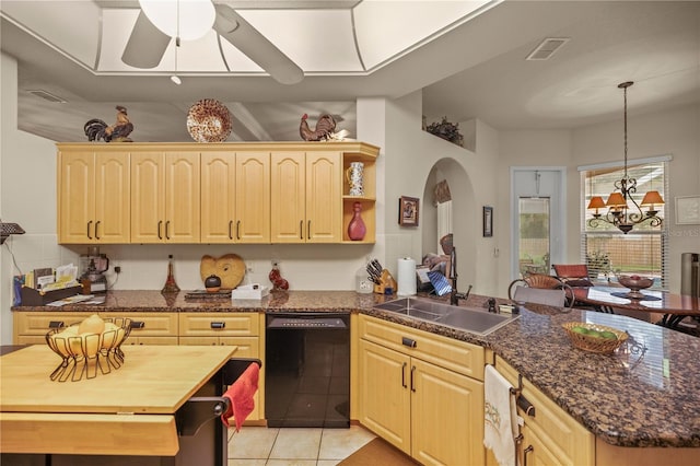 kitchen featuring ceiling fan with notable chandelier, light brown cabinets, dishwasher, and sink