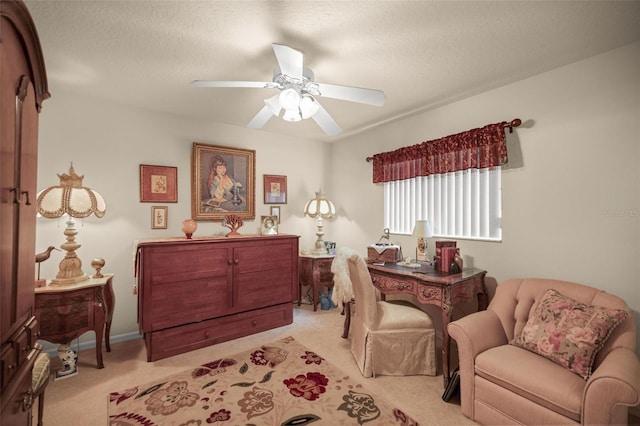 interior space featuring light carpet, a textured ceiling, and ceiling fan