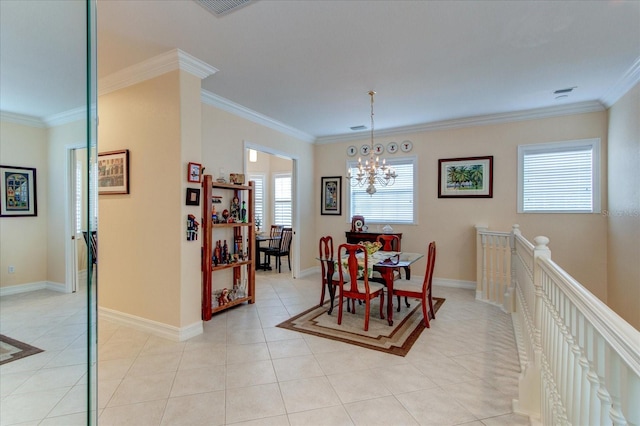 tiled dining room featuring a notable chandelier and crown molding