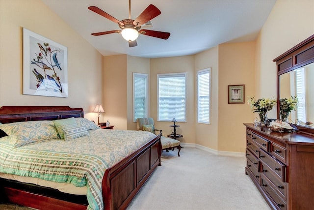 bedroom with ceiling fan and light colored carpet