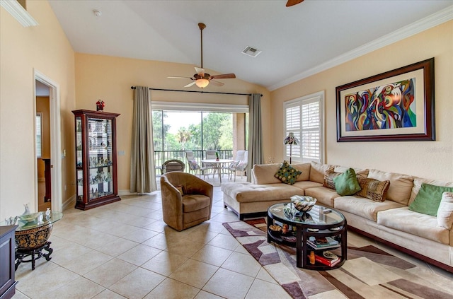 living room with lofted ceiling, ceiling fan, ornamental molding, and light tile patterned floors