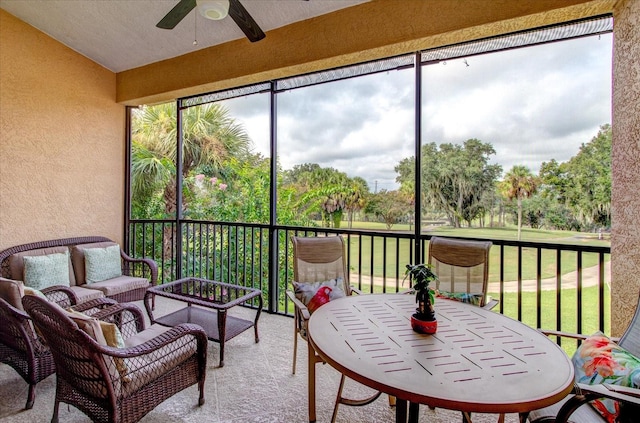 sunroom with ceiling fan