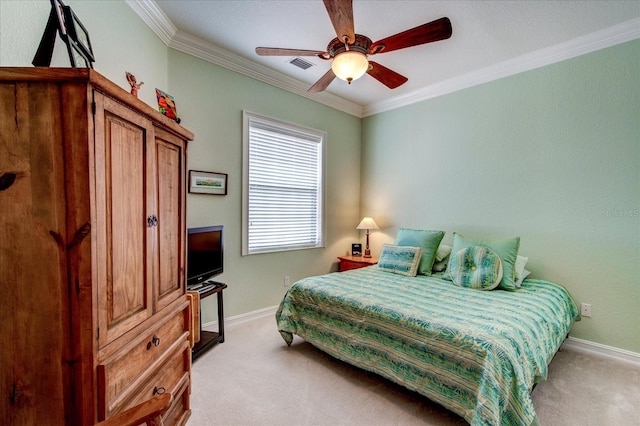 bedroom featuring ceiling fan, ornamental molding, and light carpet