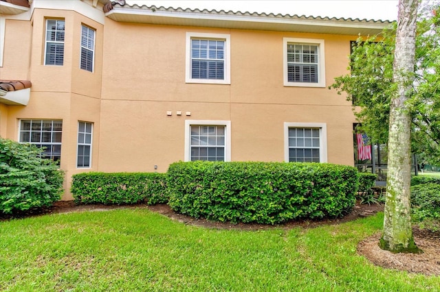 view of home's exterior featuring a yard