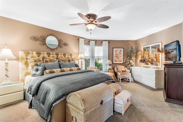 bedroom with ceiling fan and carpet