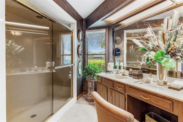 bathroom featuring vanity and a shower with shower door