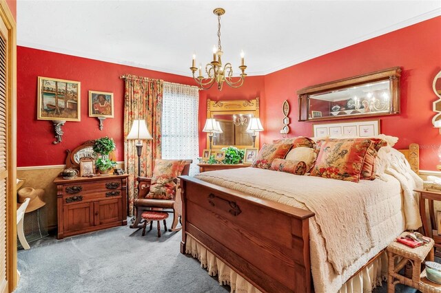 bedroom with carpet flooring, crown molding, and a notable chandelier