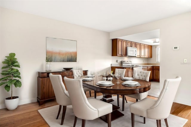 dining space featuring light hardwood / wood-style flooring