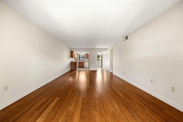 spare room featuring wood-type flooring