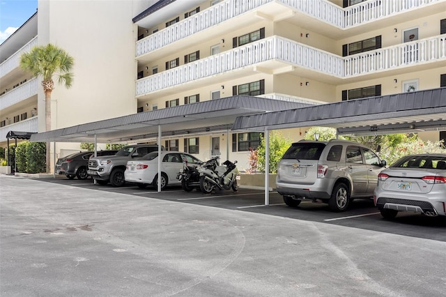 view of parking / parking lot with a carport