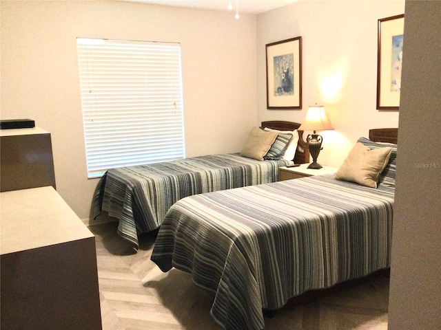 bedroom featuring light colored carpet