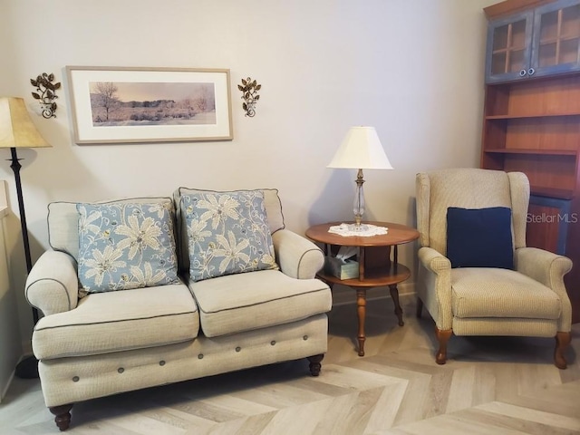 sitting room with parquet flooring