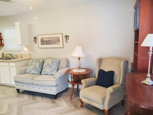 living room with sink and light parquet flooring