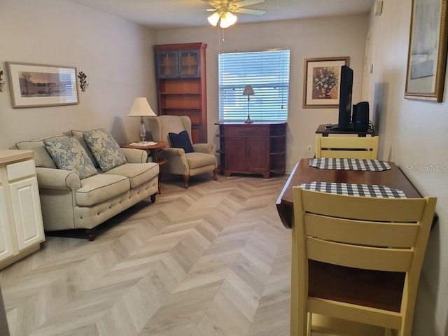 living room with light parquet floors and ceiling fan