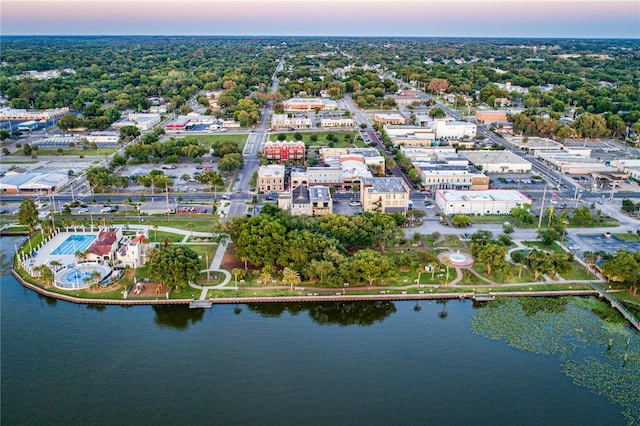 aerial view at dusk with a water view